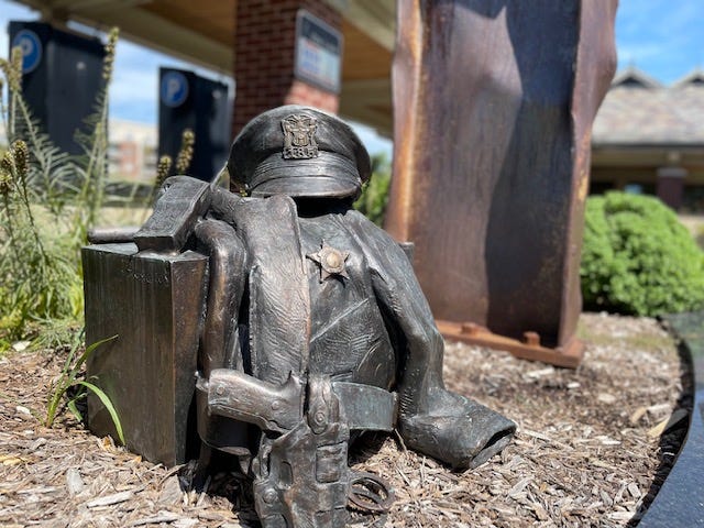 Wedged between 95th Street and Museum Drive and behind the Metra Station, an installation that incorporates four, 22-foot beams of World Trade Center Steel.