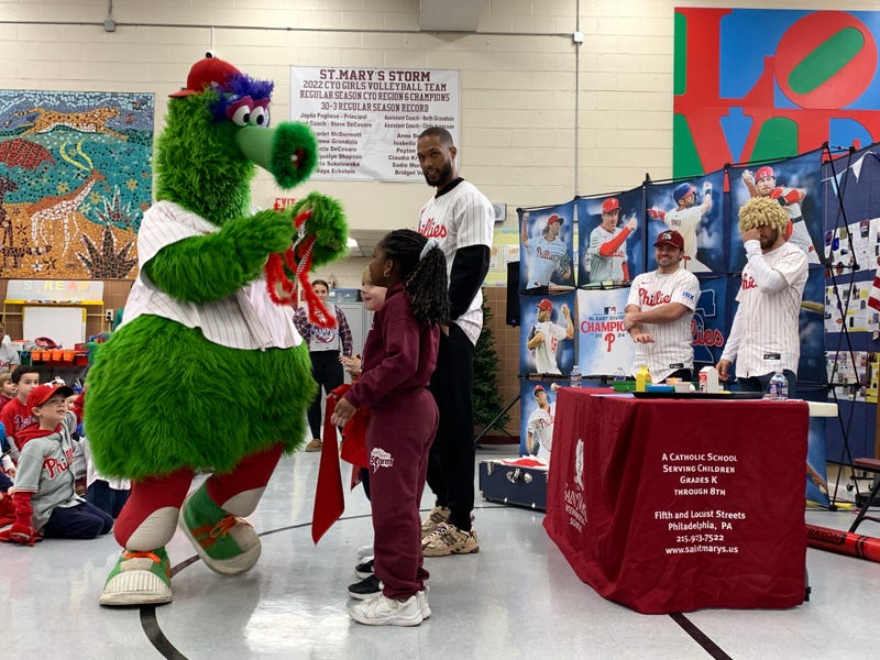 The Phillie Phanatic presents prizes to students at St. Mary Interparochial School for their involvement in the Phanatic About Reading program on Jan. 21, 2025.