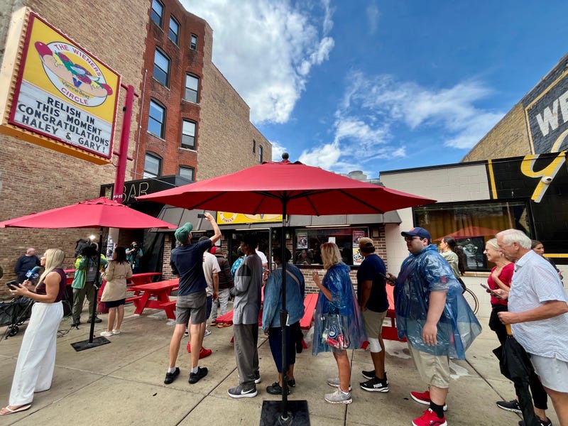 Fans line up for free Wieners Circle hot dogs
