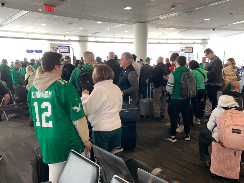 Eagles fan eagerly await their flight to Kansas for Super Bowl LIX