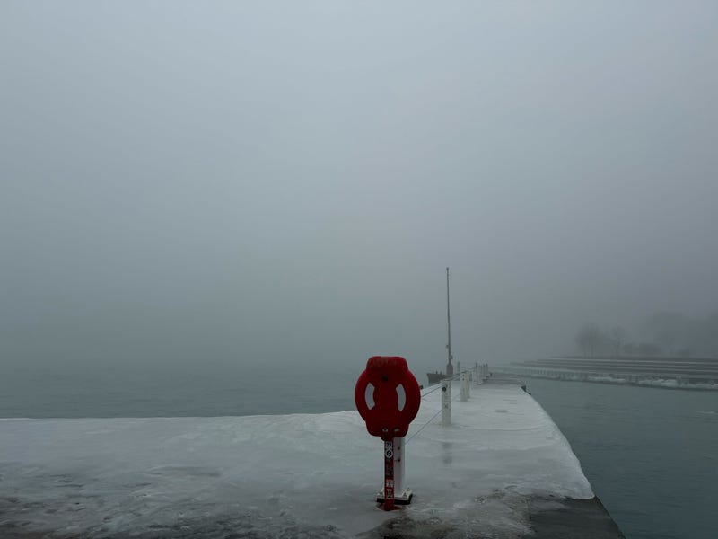 Heavy fog obscures the view from Belmont Harbor.