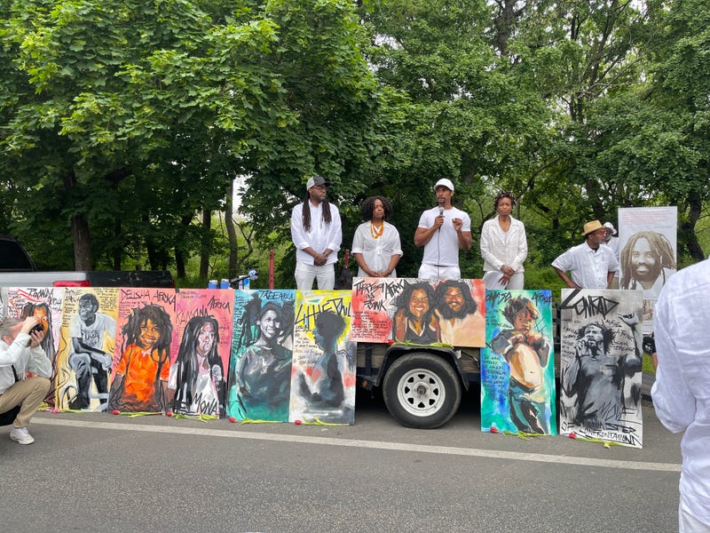 Portraits of the 11 people killed in the MOVE bombing lines Cobbs Creek Parkway on Saturday.
