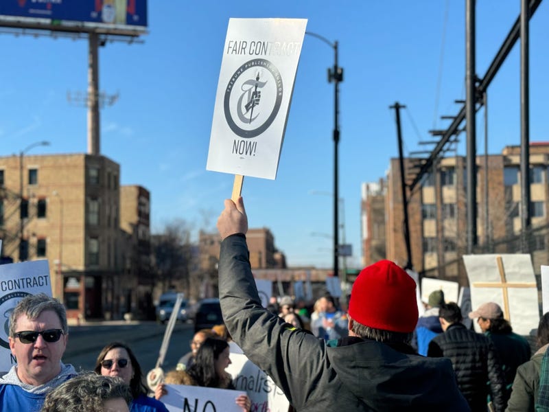 strikers with signs