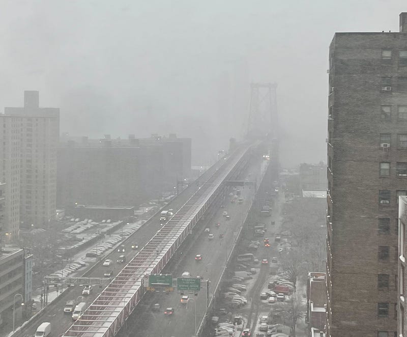 Heavy snow falls over the Williamsburg Bridge in the East Village on Feb. 13, 2024