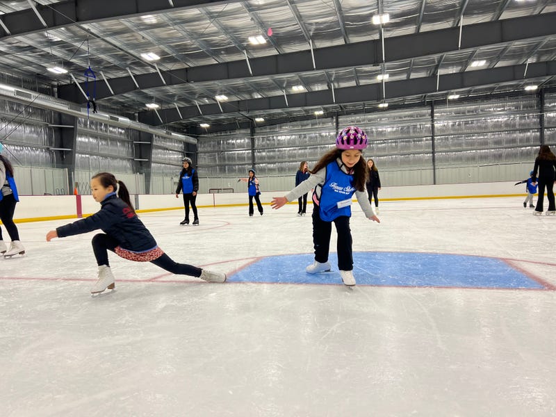 Yesenia, right, participates in the Figure Skating On Your Block program through the Chicago Youth Foundation.