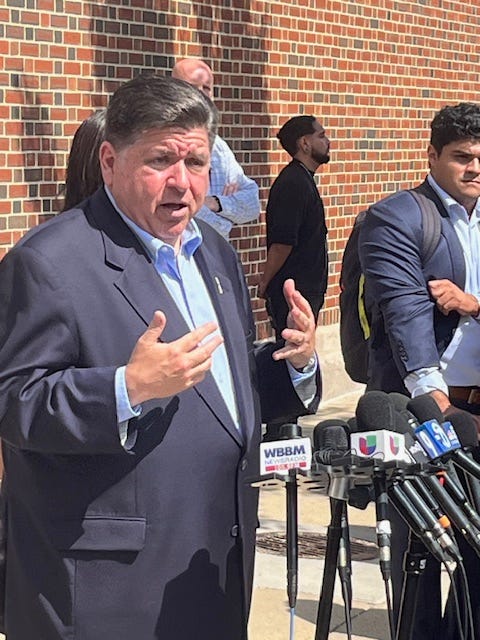 Illinois Governor J.B. Pritzker talks to reporters outside the National Museum of Mexican Art in Pilsen.