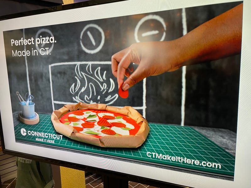 A billboard from Connecticut's new "Make It Here" marketing campaign, with the tagline "Perfect Pizza. Made in CT."
