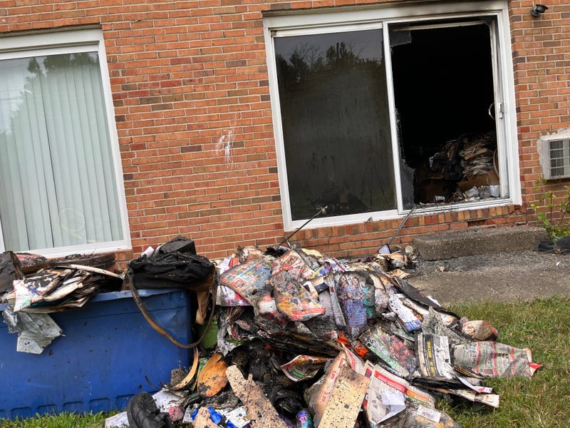 Fire crews removed the charred remains of debris from the apartment.