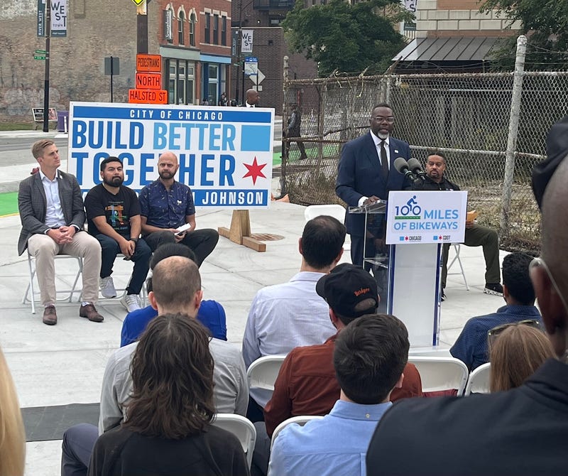 Community and business leaders joined Chicago mayor Brandon Johnson, second from right, at the "100 Miles Of Bikeways" announcement in River West.