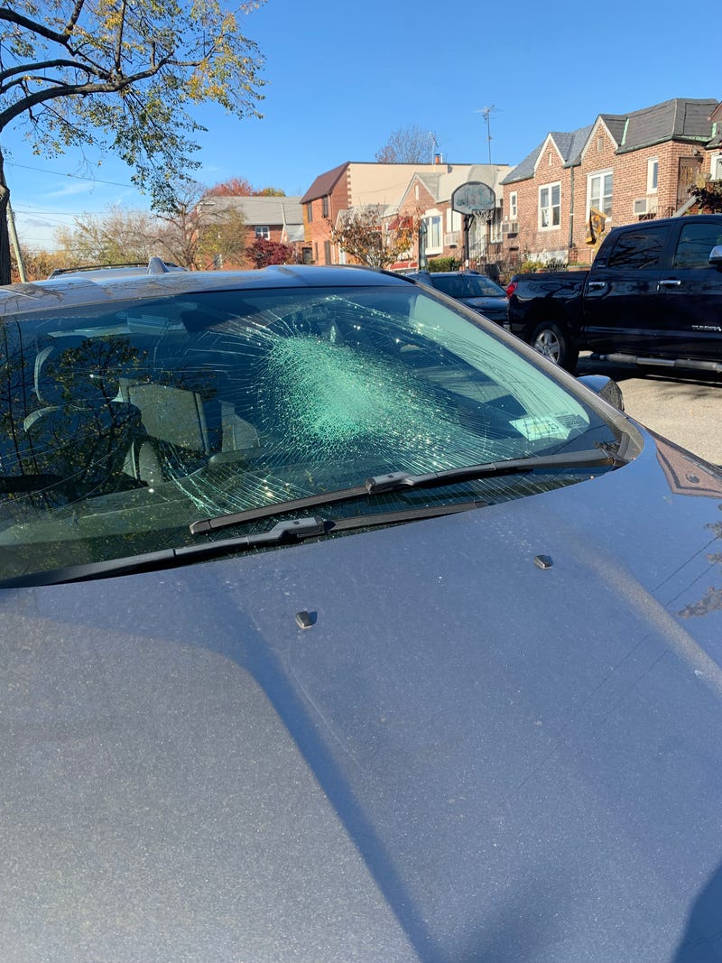 A car's broken windshield after it was allegedly stomped on by protesters in Middle Village, Queens Friday night.