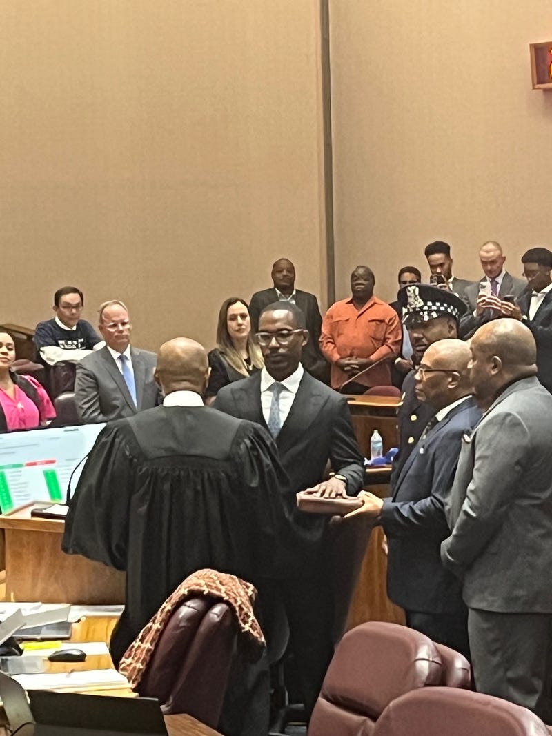 Chicago Ald. Walter "Red" Burnett, center, takes the oath of office during a meeting of the Chicago City Council, September 25, 2025.