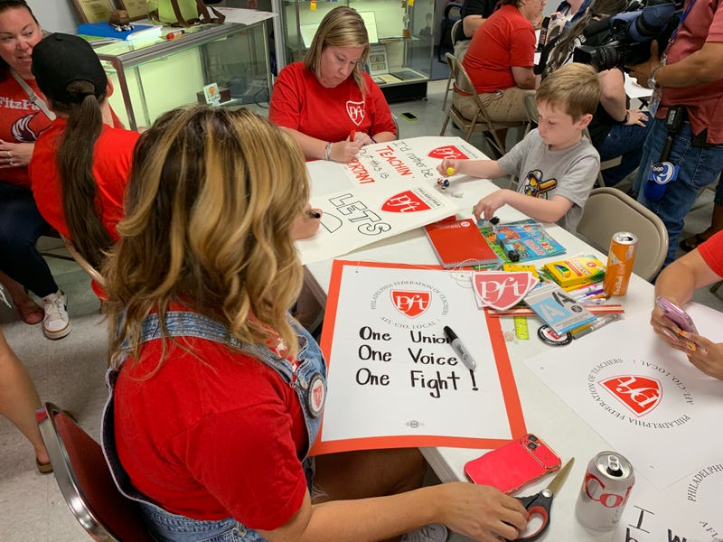 Members of the Philadelphia Federation of Teachers work on signs for a possible strike.