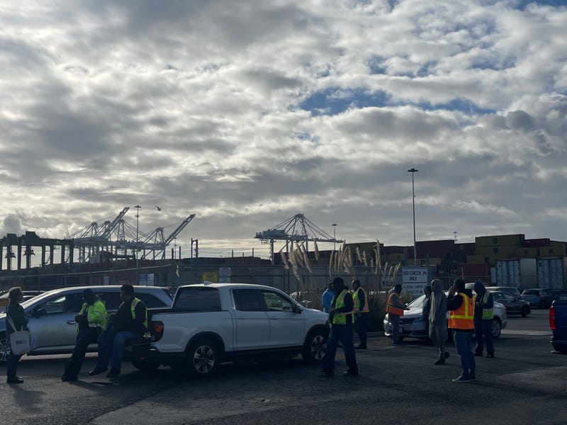 Longshoremen walk out on the job at the Port of Oakland.