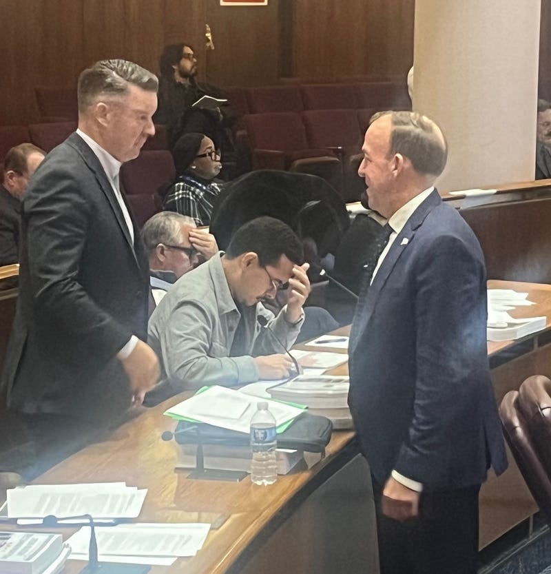 Chicago Alderman Brendan Reilly (42nd Ward, right) confers with fellow Alderman Bill Conway (34th Ward) during budget hearings at City Hall.