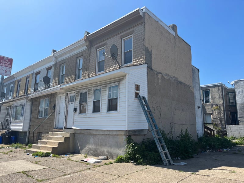 On the sidewalk next to the ladder leaning against this house, Philadelphia police found a 16-year-old boy who had been shot twice in the head.