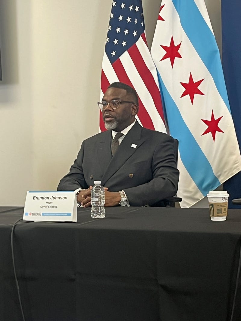 Chicago mayor Brandon Johnson talks to reporters at City Hall, October 28, 2025.