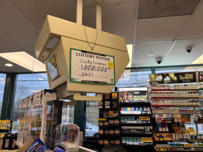 A sign at a Plymouth Meeting gas station proclaims a million-dollar Powerball winner.