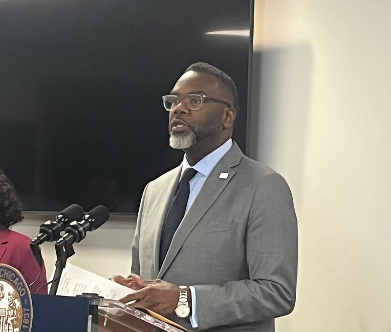 Chicago mayor Brandon Johnson talks to reporters at City Hall. 