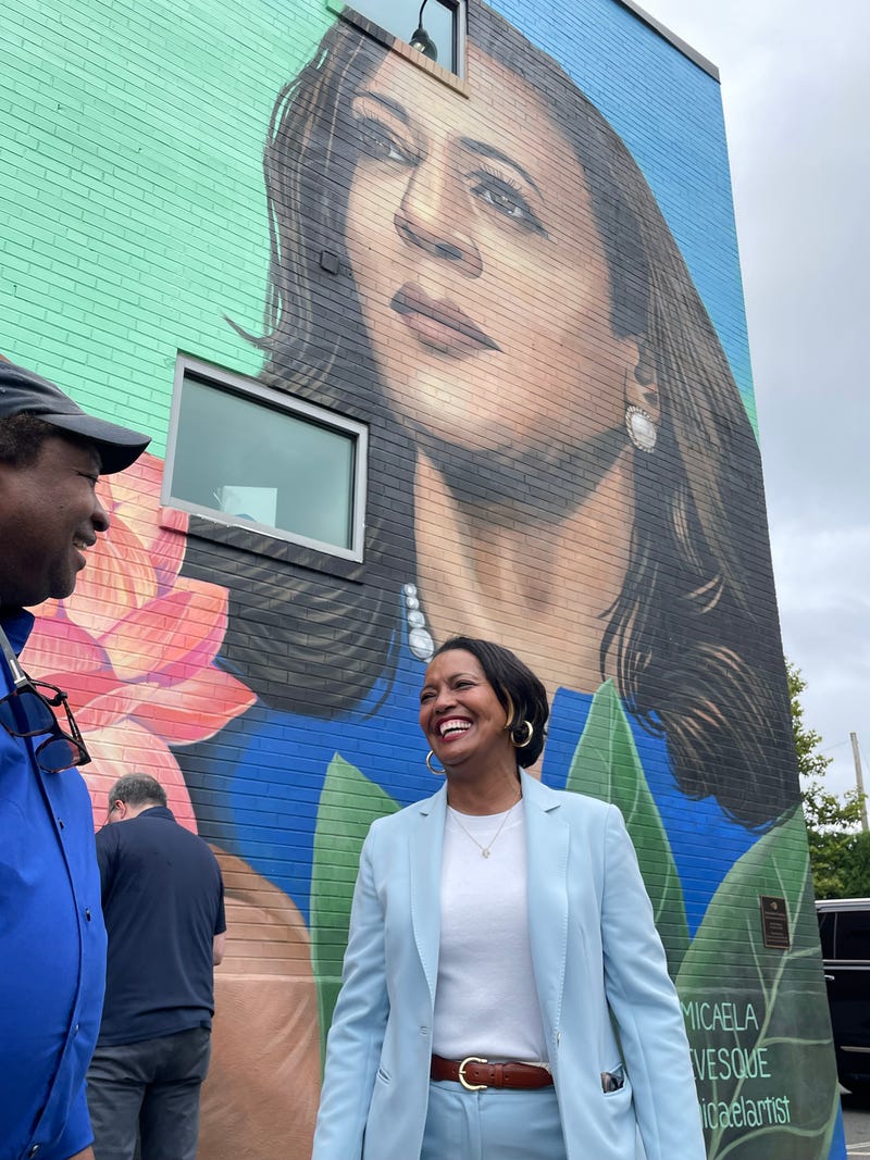 Rep. Jahana Hayes (D-CT5) greets a supporter near a mural depicting Vice President Kamala Harris at a state Democrats' news conference supporting Harris and VP nominee Tim Walz in Hartford, 8/6/24