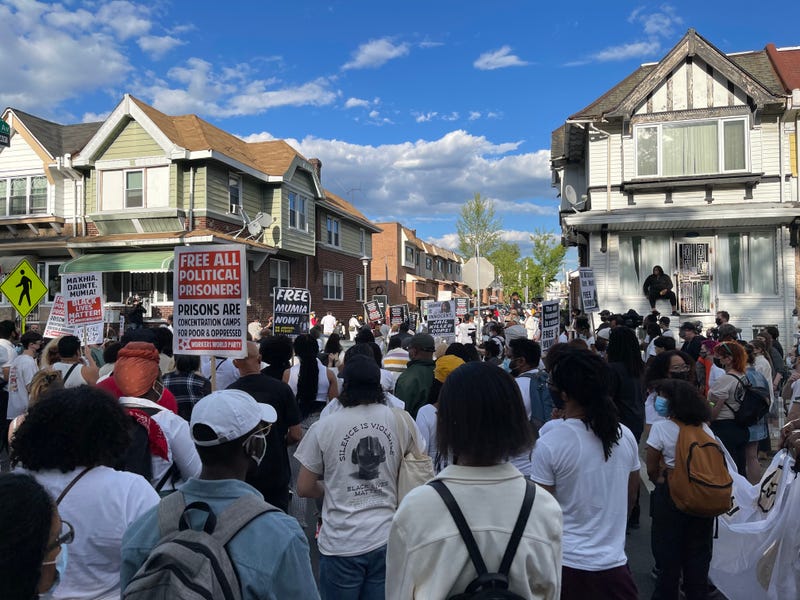 Marchers marking 36 years after the MOVE bombing in West Philadelphia.