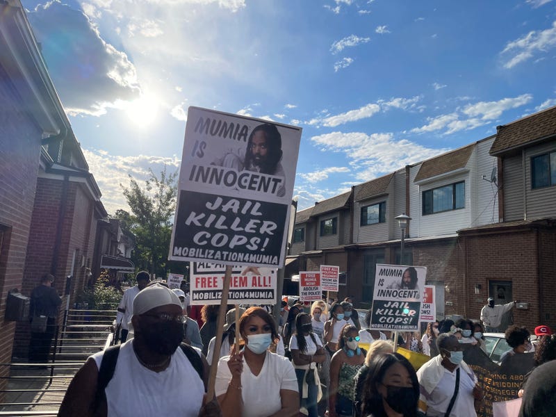 Marchers marking 36 years after the MOVE bombing in West Philadelphia.
