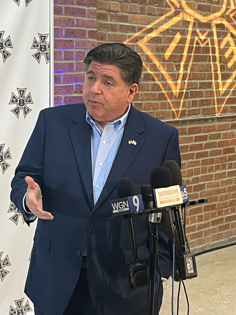 Illinois Governor J.B. Pritzker talks to reporters in Chicago.