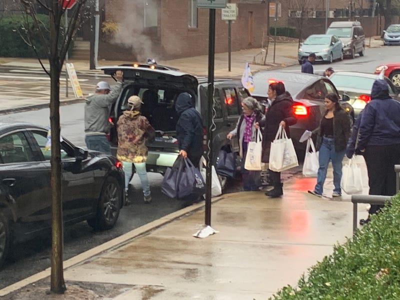 Hundreds of volunteers spent part of their Thanksgiving holiday preparing packaging and delivering meals for the critically