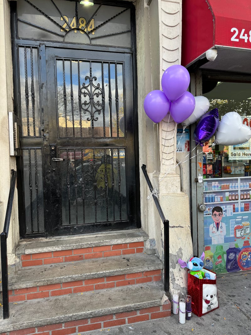 Community mourners on Monday put balloons, candles and gifts outside the apartment where 4-year-old Jahmeik Modlin was found dead on Sunday.