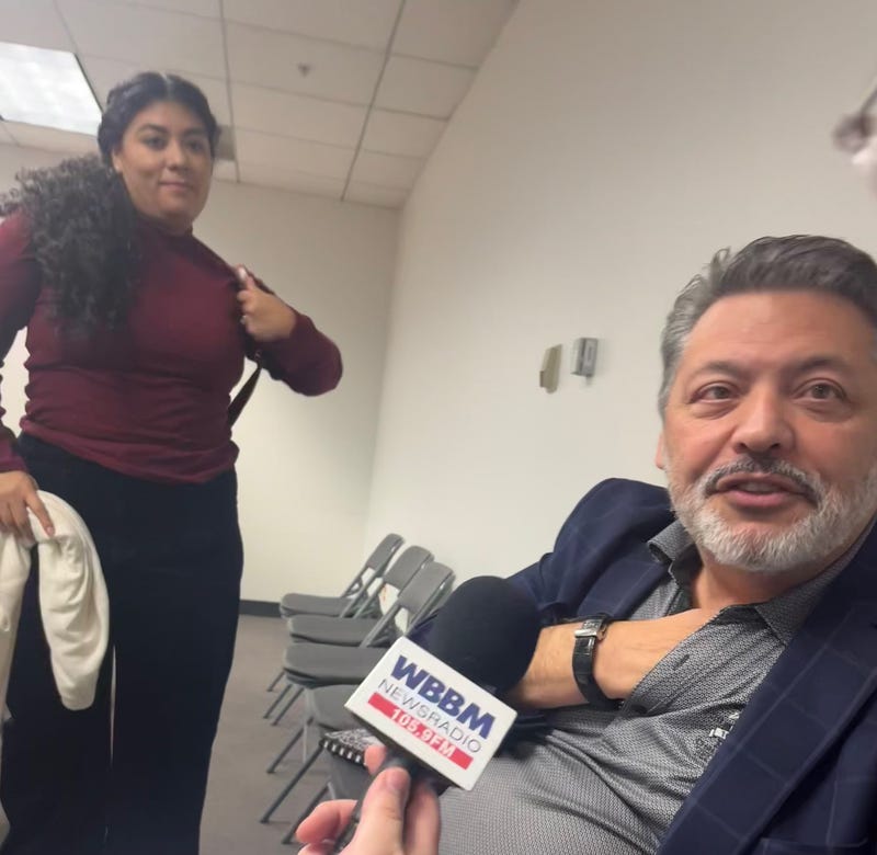 Seventh District Democratic Congressional Candidates Jazmin J. Robinson (left) and Felix Tello prepare to defend the signatures on their nominating petitions.