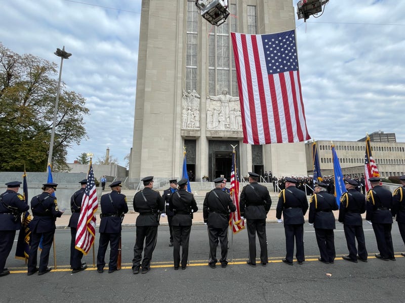 First responders line up in front of St. Joseph's Cathedral in Hartford, saluting the memory of firefighter Robert Sharkevich, Sr. on the day of his funeral.