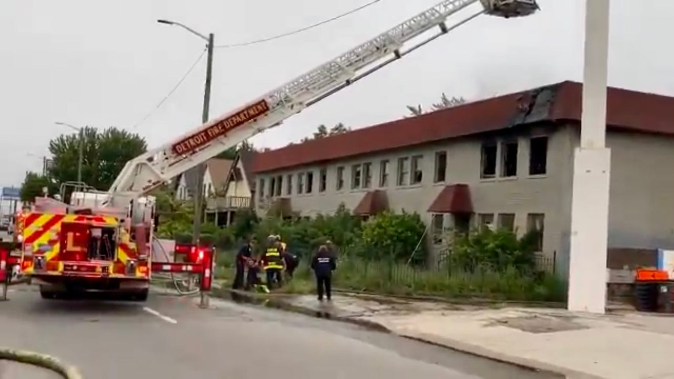 Detroit firefighters rescue squatters from blaze at abandoned apartment building