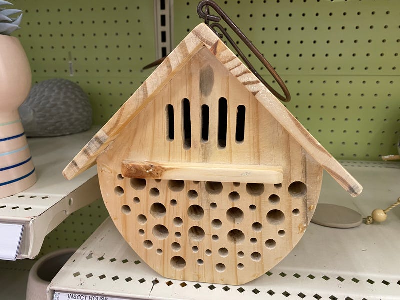 wooden insect house on shelf