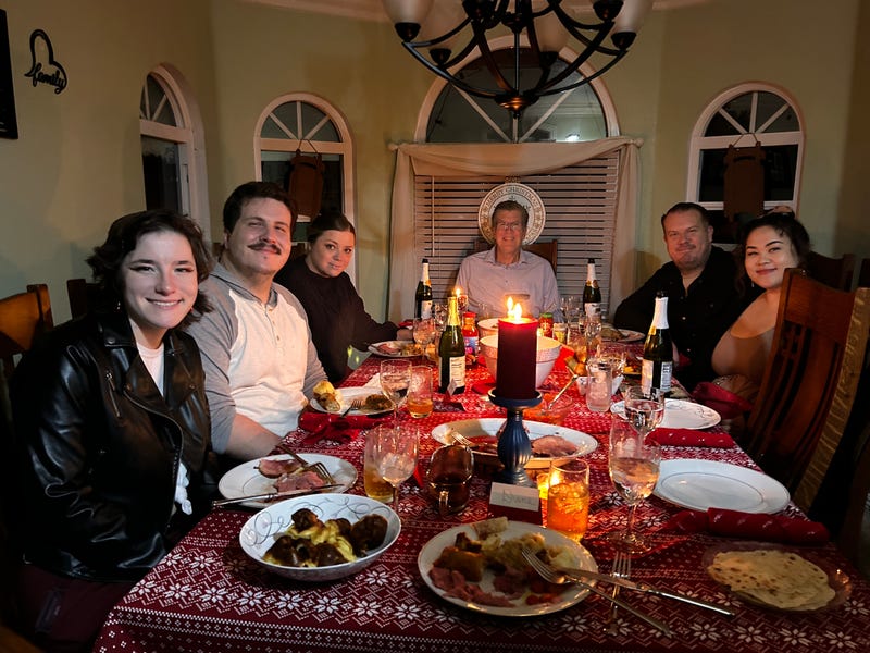 Beckman family having Christmas Eve dinner by candlelight in Norwalk