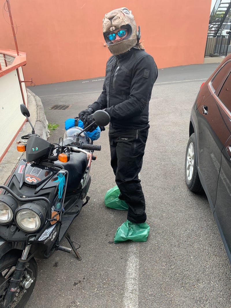 idiot with trash bags on his feet