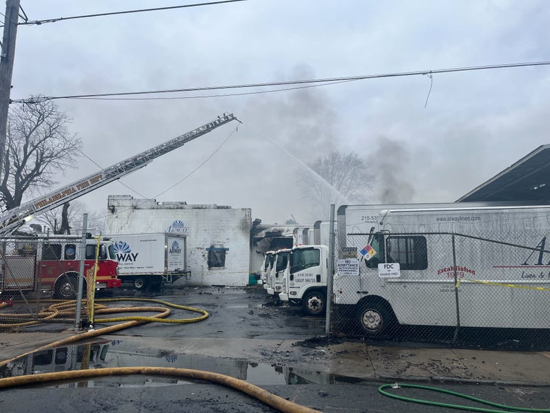 Firefighters work to extinguish a fire in the city's Frankford neighborhood.