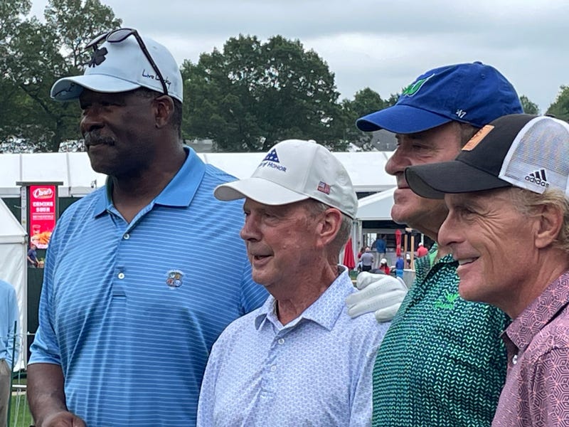 A celebrity group in the Travelers Championship Pro-Am (L-R): Pro Football Hall of Fame member Andre Tippett, PGA Tour legend Larry Nelson, ESPN's Chris Berman and famed quarterback Doug Flutie