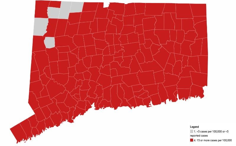 Map showing average daily rate of new COVID-19 cases by town over the last two weeks. "Red" is high transmission, at least 15 cases per 100,000 population.