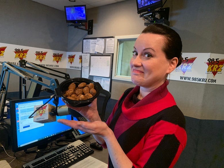 Lissa holding a container of Irish Potatoes
