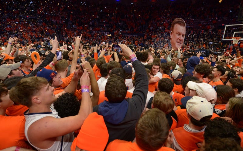 Illinois fans celebrate after a win against Iowa on Sunday clinched a share of the Big Ten crown.