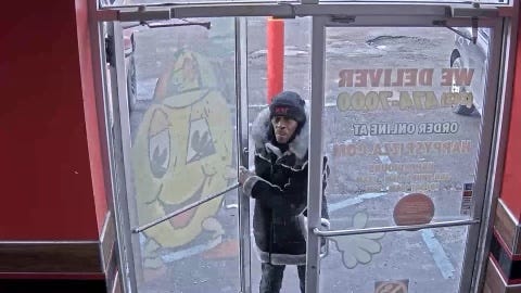 Man walking through door
