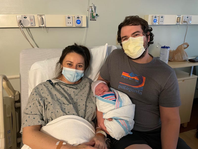 Scott and Jessica Killian cradle newborn Otto
