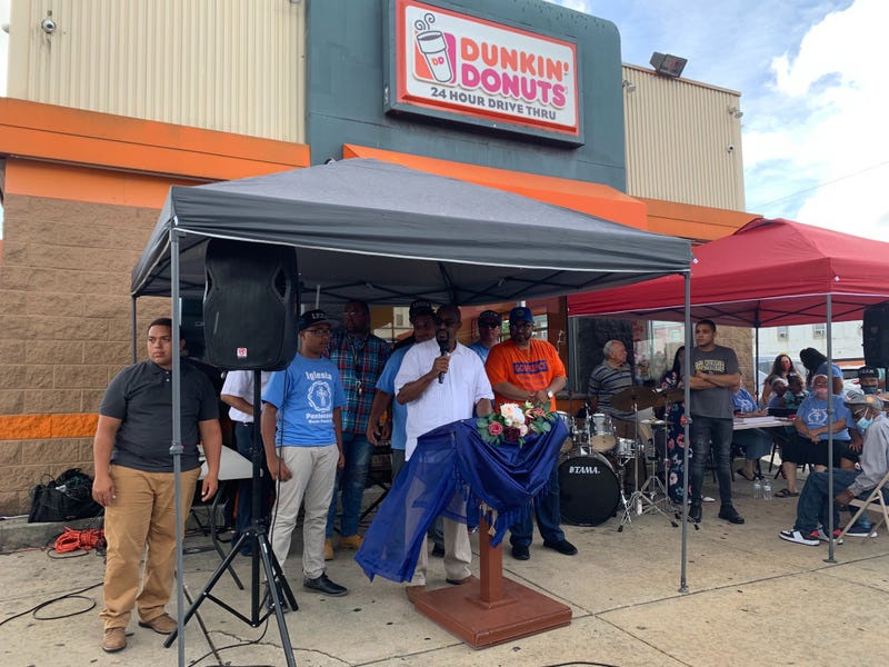 A group of interfaith community leaders gathered Saturday in front of the Dunkin Donuts where manager Christine Lugo was shot and killed by an armed robber, to call for action against the city's gun violence.