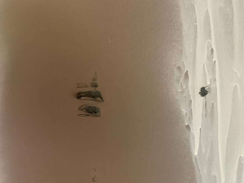 Up close, scratches and tears can be seen in the murals.