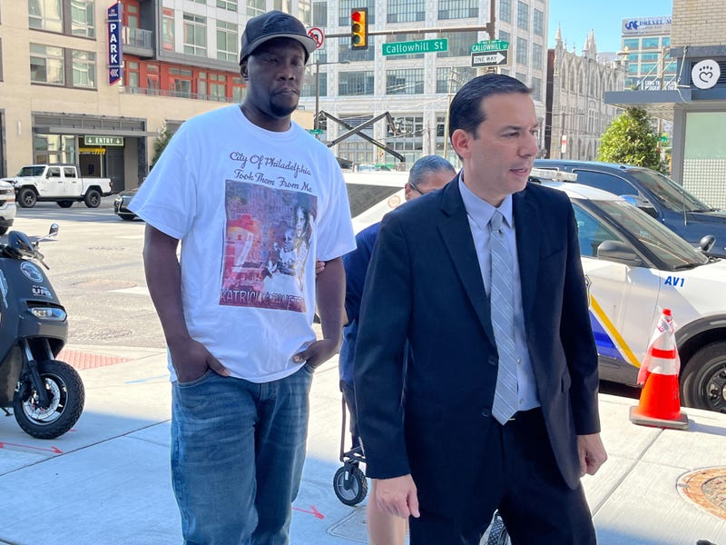 Lionel Dotson (left) walks into the Philadelphia Medical Examiner's Office on Aug. 3, 2022, to obtain the remains of his sisters: 1985 MOVE bombing victims Katricia and Zanetta Dotson.
