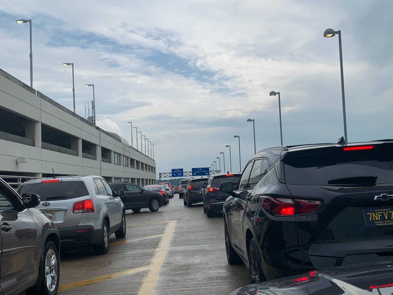 Travelers coming to and from Detroit Metro Airport are at a standstill after a bus crash snarled traffic Friday evening, WWJ's KT reports.