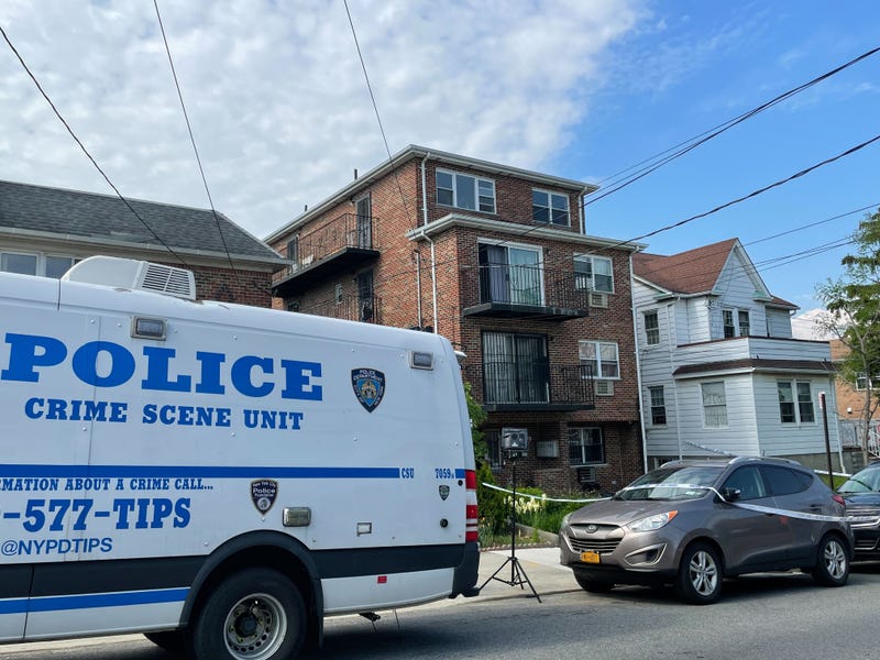The apartment building where police say a man climbed to the third story balcony and stabbed a man to death.