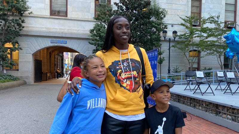 Kahleah Copper, WNBA Finals MVP, with two young fans at her City Hall celebration Monday.