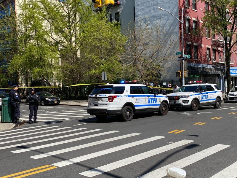 Police blocked off East 4th Street at Avenue C after the shooting Friday morning