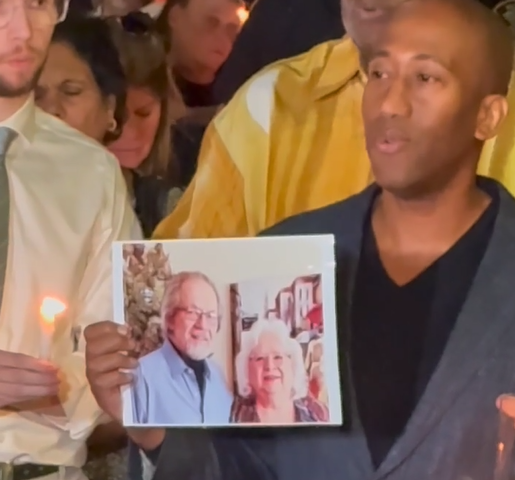 A photo of Frank and Maureen Olton at a vigil for them shortly after the murders