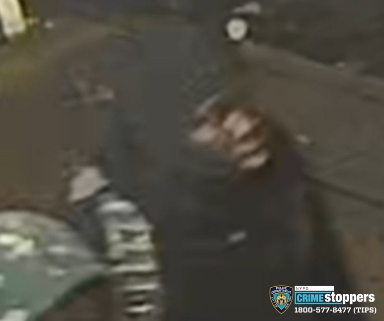 One of the individuals being sought in relation to a robbery.